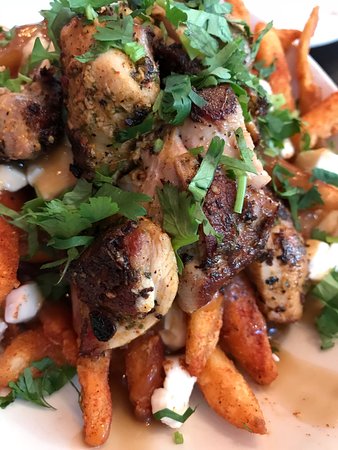 BADMAASH signature dishes Chicken Tikka PoutineButter Chicken (murgh makhani)Spiced Lamb Burger